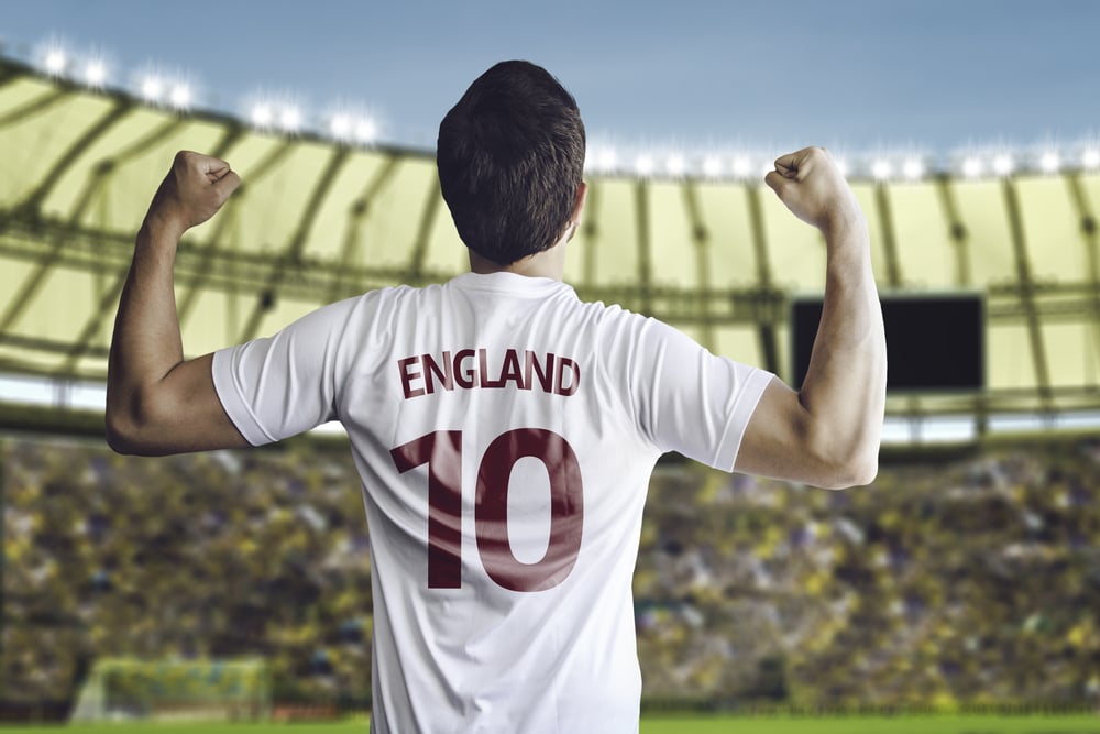 English soccer player celebrates with the fans on the stadium